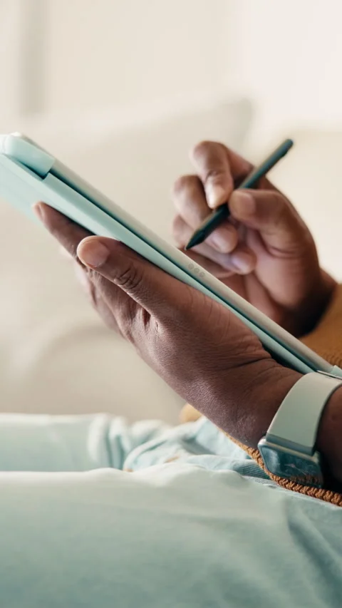 Tablet, pen and hands of man on sofa in home for remote work with web Stock Footage 338009271