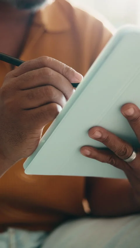 Tablet, pen and hands of man on sofa in house for remote work with web Stock Footage 338010021