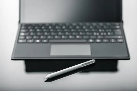 Tablet with pen on shiny surface Stock Photos