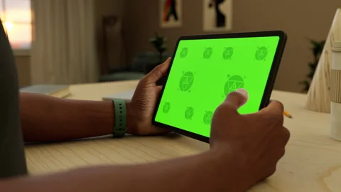 A tablet in a person's hand on an home office desk Stock Footage 292909857