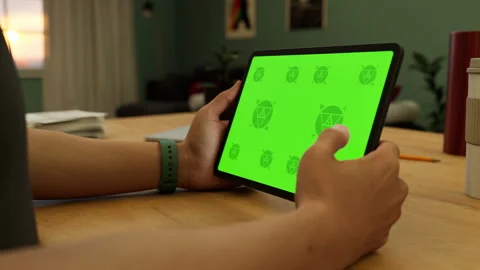 A tablet in a person's hand on an home office desk Stock Footage 292909866