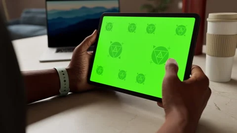 A tablet in a person's hand on an home office desk Stock Footage 292909912
