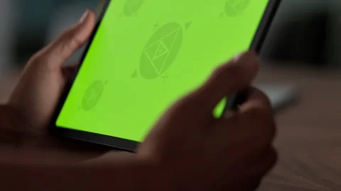 A tablet in a person's hand on an home office desk Stock Footage 292909926