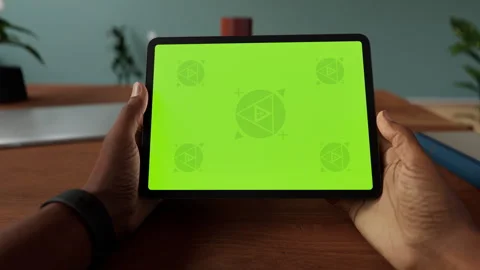 A tablet in a person's hand on an home office desk Stock Footage 292910012