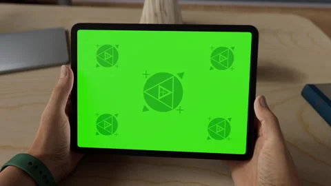 A tablet in a person's hand on an home office desk Stock Footage 292910023