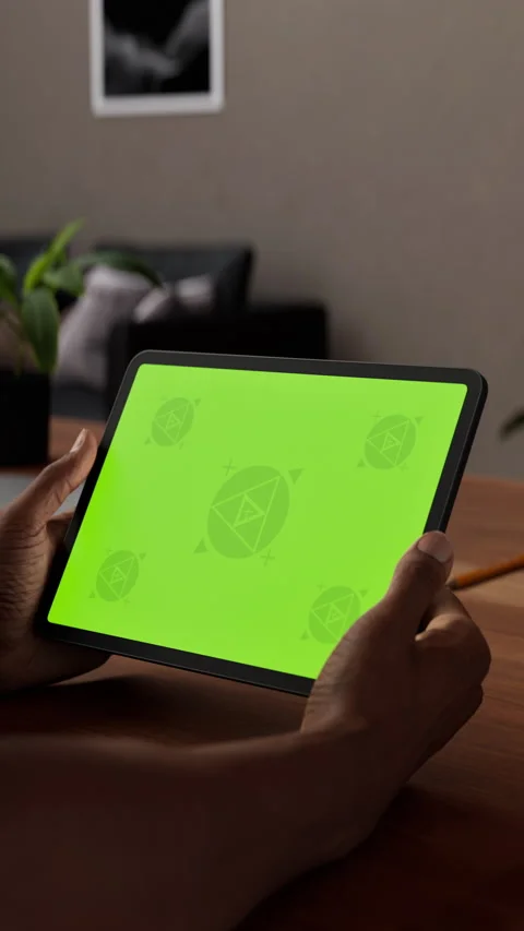A tablet in a person's hand on an home office desk Stock Footage 292910026