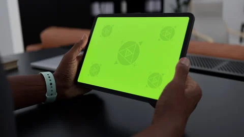 A tablet in a person's hand on an home office desk Stock Footage 292910699