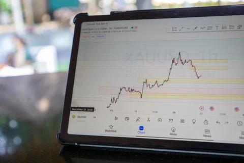 Tablet phone on the dining table. Trading foreign exchange anywhere Stock Photos
