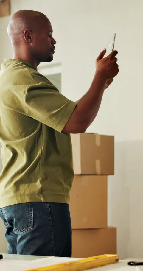Tablet, photography and man in new home, moving and interior design app for Stock Footage 336837726