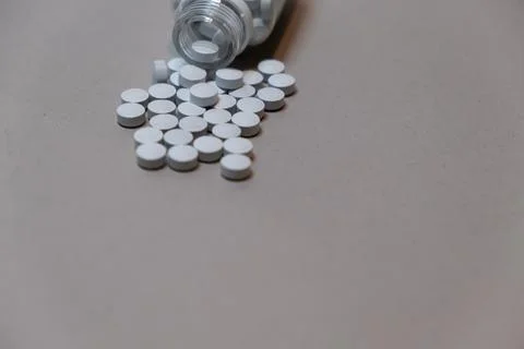 Tablet pills on a flat background with copy space. For advertising and health Stock Photos