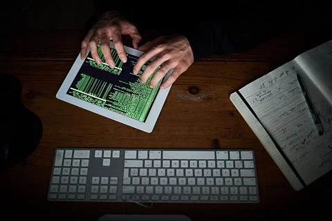 Tablet, programmer hands and code screen with software for hacking crime or Stock Photos