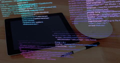 Tablet with programming code and pen on wooden desk, animation showing Stock Footage 303607922
