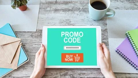 Tablet with promo code field on screen. E-commerce, mobile marketing concept. Stock Photos
