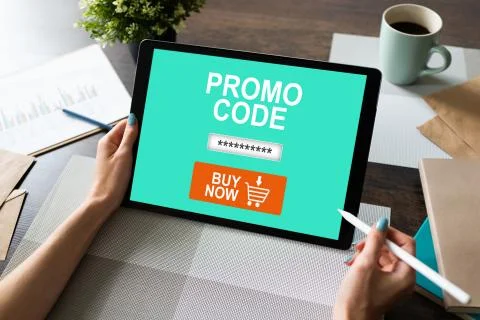 Tablet with promo code field on screen. E-commerce, mobile marketing concept. Stock Photos