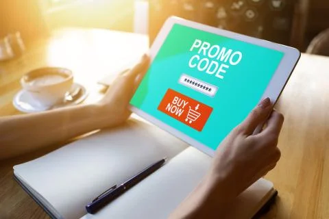 Tablet with promo code field on screen. E-commerce, mobile marketing concept. 写真素材
