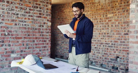 Tablet, reading or man with laptop at construction site, maintenance planning or Stock Footage 336778140