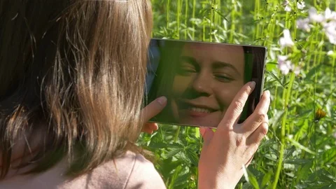 Tablet reflecting smiling female face Video stock 75015298