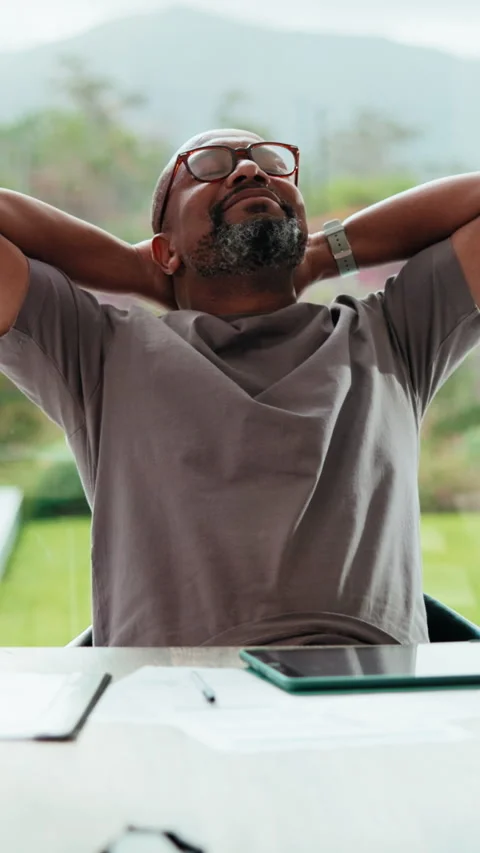 Tablet, relax and black man in home with completed project for remote work with Stock Footage 335886559