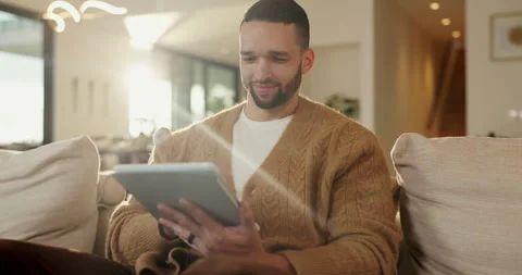Tablet, relax and man in home, typing or online search for news website with app Stock Footage 335283472