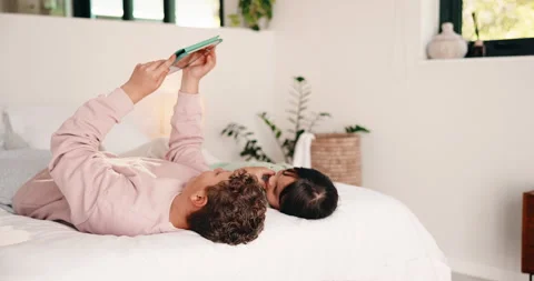 Tablet, relax and scroll with children in bedroom for streaming service, bonding Stock Footage 335532290