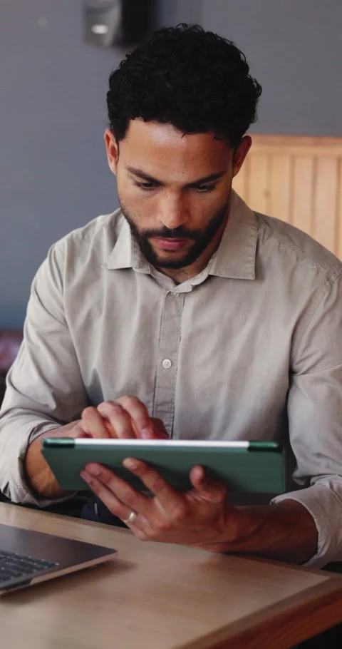 Tablet, remote work and man in cafe, reading report or creative review with Stock Footage 331467327