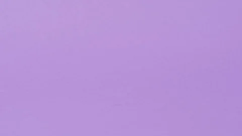 Tablet is rolling on a purple background. Stock Footage 127695030