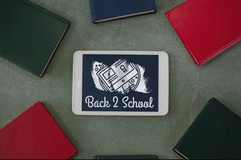 Tablet on a school table with back to school text on screen Stock Photos