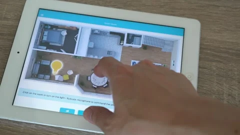 A tablet with a screen showing Smarthome or Home automation Stock Footage 314455349