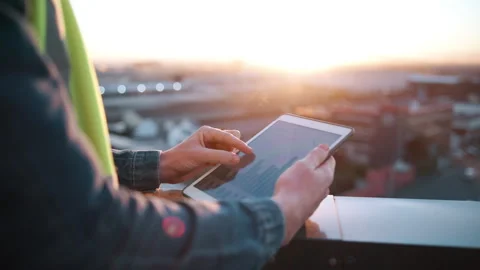 Tablet screen, statistics and hands of construction worker in city for planning, Video stock 338005461