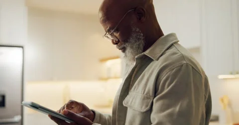 Tablet, scroll and glasses with black man in home for streaming service, movie Stock Footage 337539567