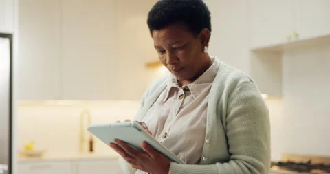 Tablet, scroll and reading with black woman in home for streaming service, movie Stock Footage 337540978