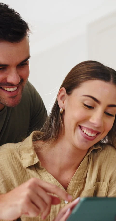 Tablet, scrolling and couple in home with texting, social media or funny meme on Stock Footage 337155645