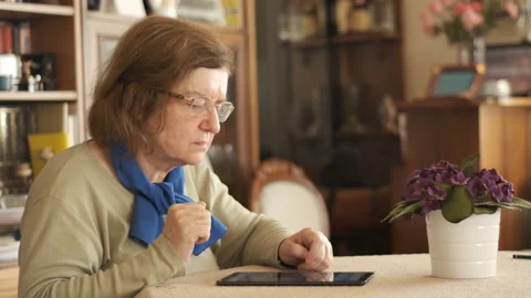 Tablet. Senior adult using digital technology device. Видео 144722997