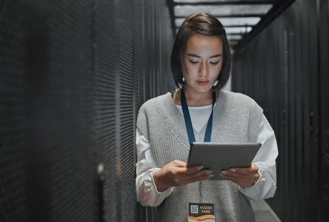 Tablet, server room and cloud computing with a programmer asian woman at work on 스톡 사진