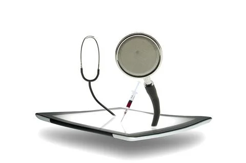 Tablet with a stethoscope Stock Photos