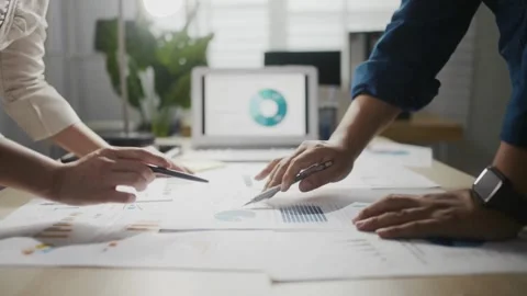 Tablet, strategy and documents with hands of business people in meeting for Stock Footage 334654316