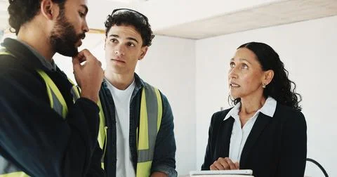 Tablet, talking and construction team with building inspector for site visi.. 写真素材