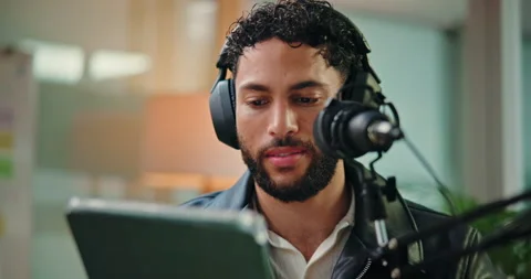 Tablet, talking and man with mic in studio for podcast, broadcast or interview Stock Footage 312380619
