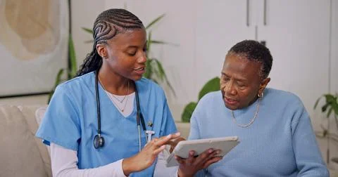 Tablet, talking and nurse with old woman in home for consulting, telehealth.. Stock Photos