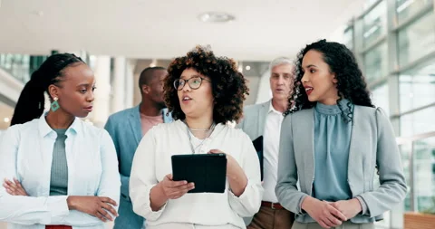 Tablet, team leader and walking business women, workforce or staff teamwork on Stock Footage 247200112