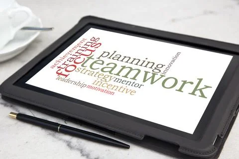 Tablet with teamwork word cloud Stock Photos