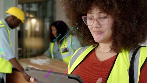 Tablet tech tapping screen updating AR while warehouse crew inspecting box Stock Footage 333287157