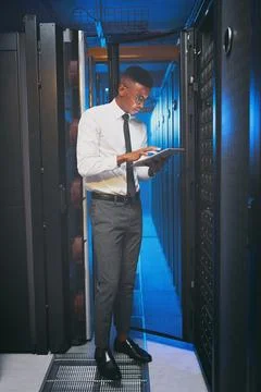 Tablet, technician or black man in server room for inspection, software update Stock Photos