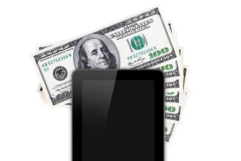 Tablet technology on hundred banknotes Stock Photos
