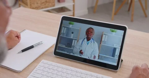 Tablet telehealth session with doctor explaining advice during remote home care Видео 327970623
