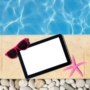 Tablet template by poolside with sunglasses and starfish Stock Photos