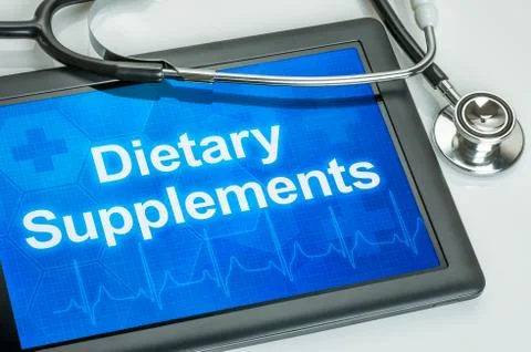 Tablet with the text dietary supplements on the display Illustrazione stock