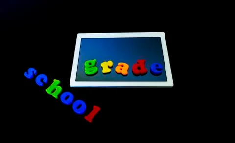 Tablet with text SCHOOL.Tablet PC, technology and education. Back to school c Stock Photos