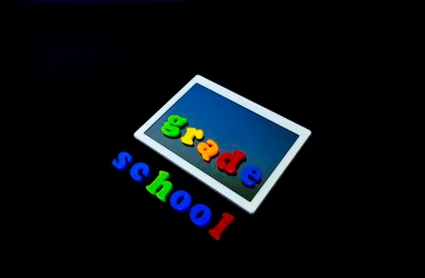 Tablet with text SCHOOL.Tablet PC, technology and education. Back to school c Stock Photos