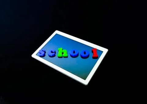 Tablet with text SCHOOL.Tablet PC, technology and education. Levitation, blac Stock Photos